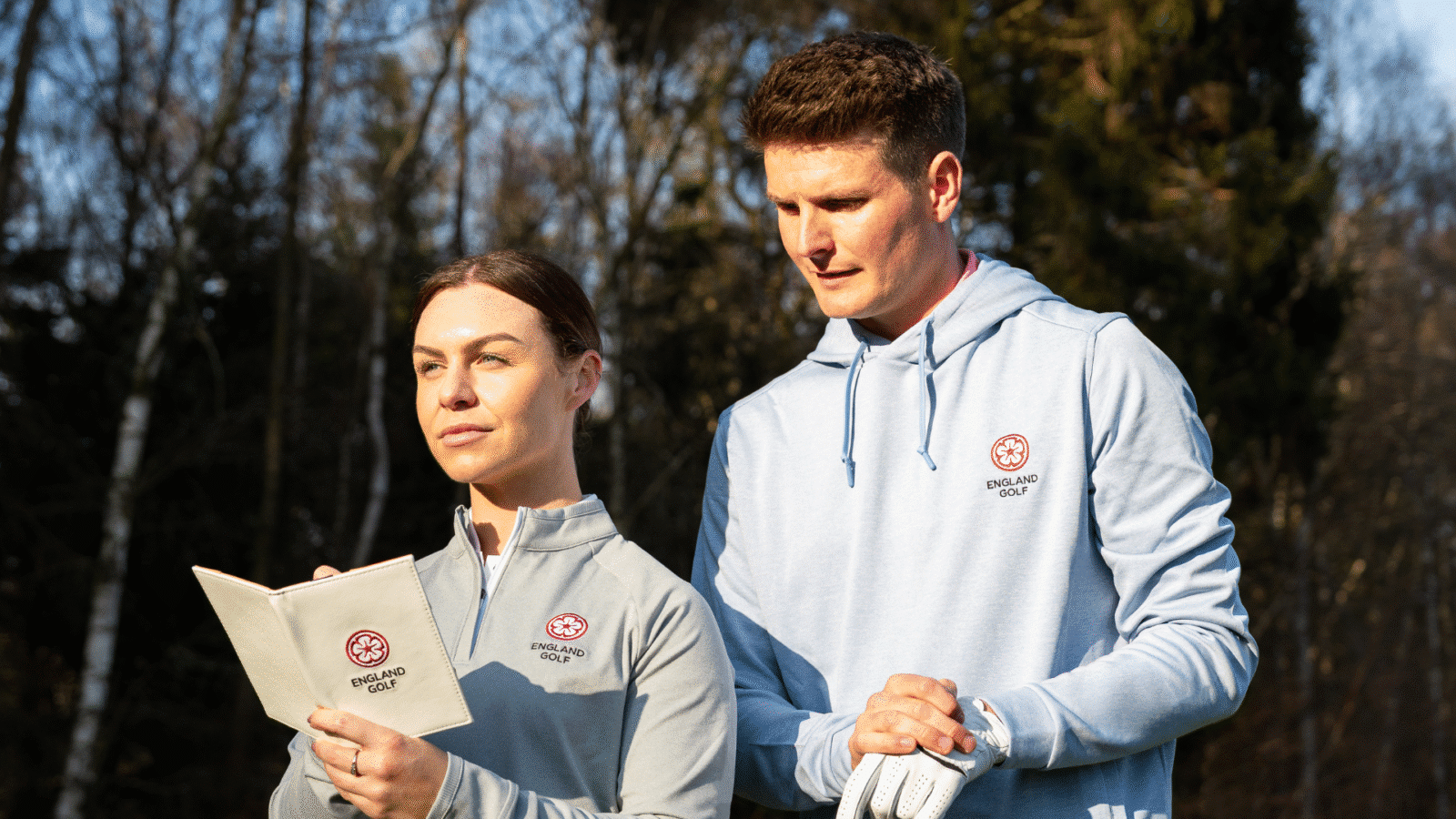 Two England Golf members looking at a scorecard